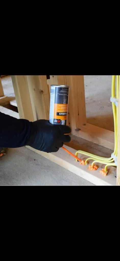 Head-of-wall and edge-of-slab joint firestop sealant in a New Jersey building